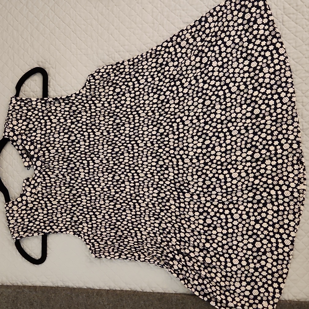 New, black, and white, corrugated silky  tank Top with one back button.